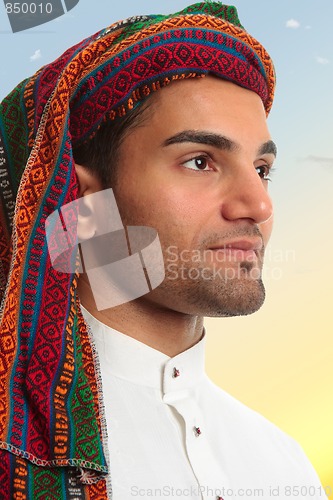 Image of Arab man looks out expectantly