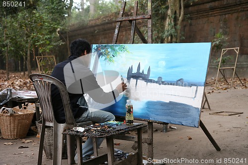 Image of Cambodian painter painting Angkor Wat