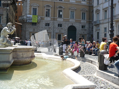 Image of Italy. Rome. Fontana del Nettuno on Piazza Navona and little boy in it  