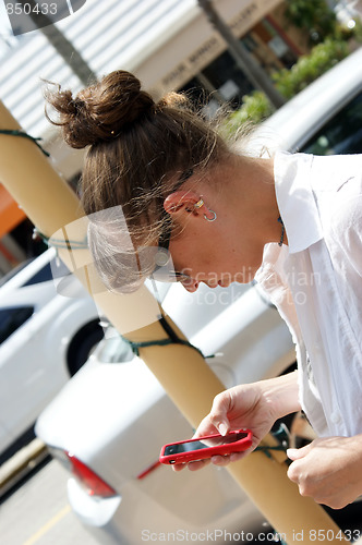 Image of young woman using phone