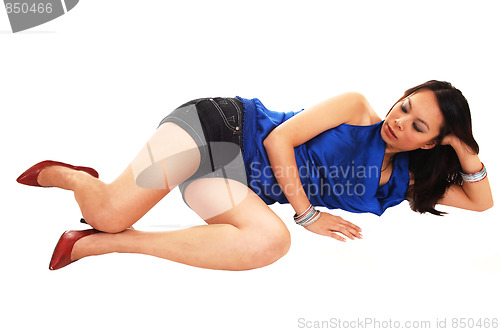 Image of Asian girl lying on the floor.