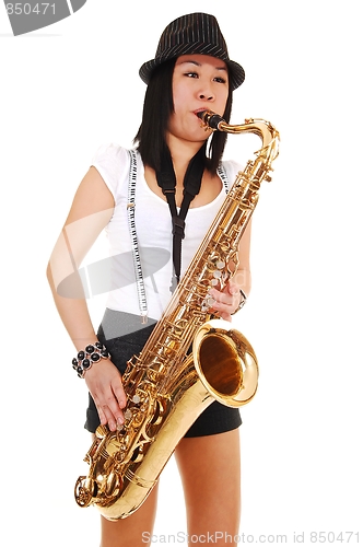 Image of Chinese girl playing the saxophone.