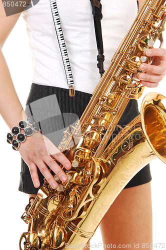 Image of Chinese girl playing the saxophone.