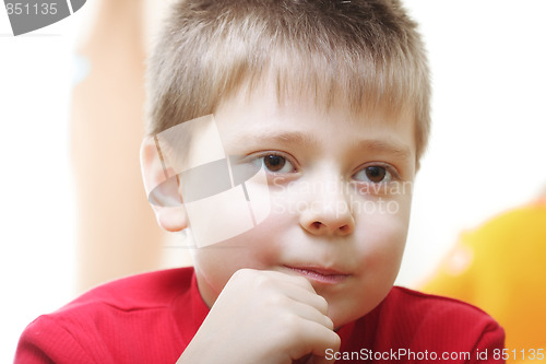 Image of Kid in red looking forward