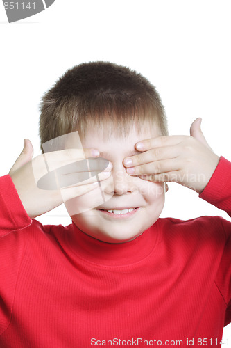 Image of Smiling boy in red shutting eyes