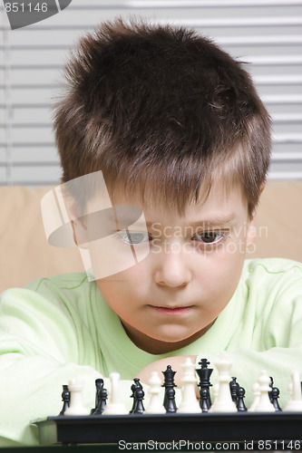 Image of Boy in green and chess