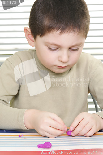 Image of Kid with plasticine