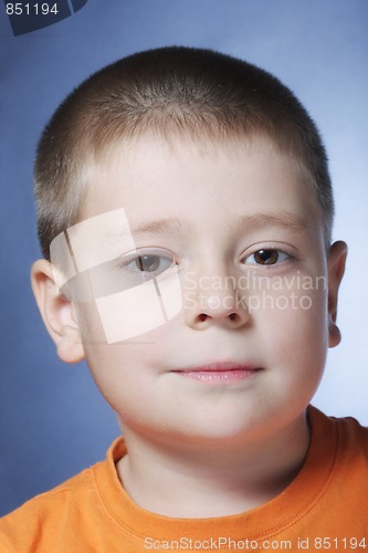 Image of Serene boy in orange