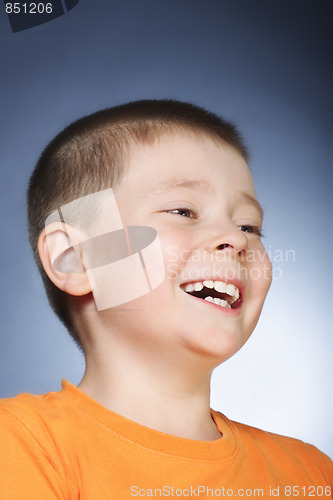 Image of Laughing kid in orange shirt