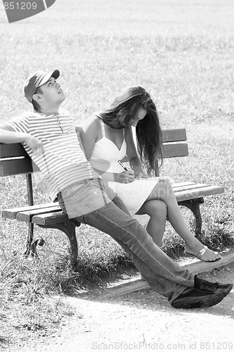 Image of Couple on bench monochrome