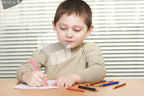 Image of Boy drawing at desk