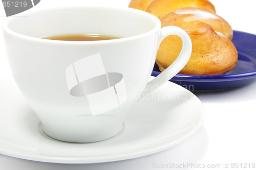 Image of Tea and bun closeup