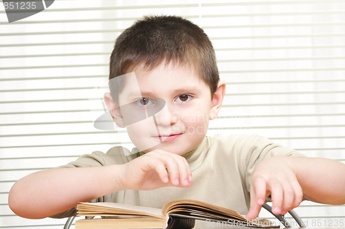 Image of Positive boy with book