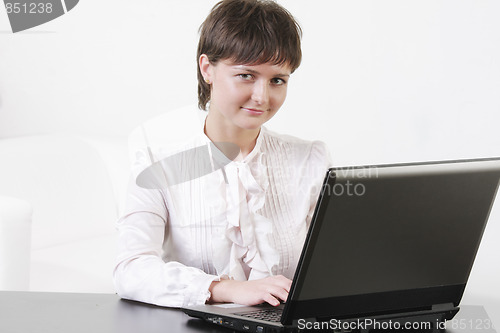 Image of Cute businesswoman with computer