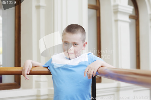 Image of Boy leaning on banister