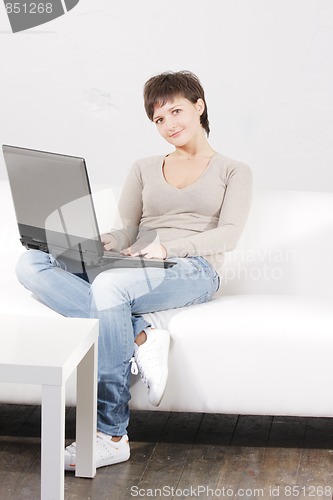 Image of Young woman with laptop