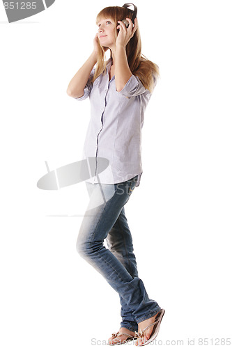 Image of Woman in headphones looking to side