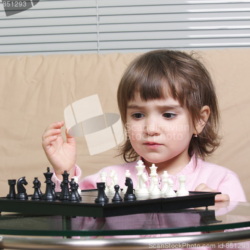 Image of Girl playing chess