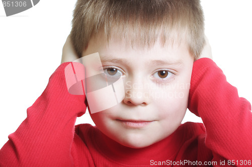 Image of Kid in red closing ears