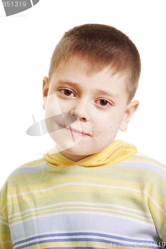 Image of Serene boy in yellow striped sweater