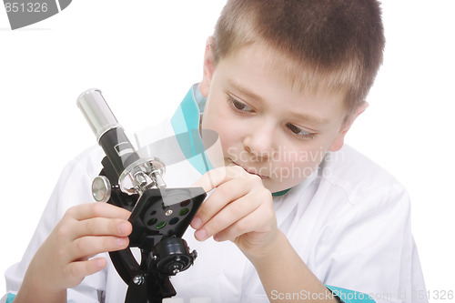 Image of Kid adjusting microscope