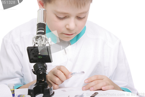 Image of Boy working with magnifying glass