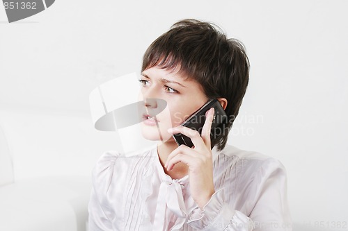 Image of Serious businesswoman on phone
