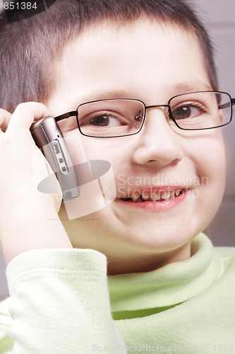 Image of Smiling boy with cell phone