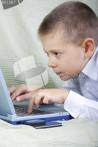 Image of Boy working on laptop