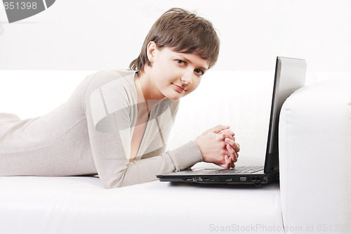 Image of Woman on sofa with computer