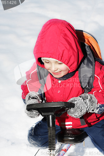 Image of Smiling kid on sledge