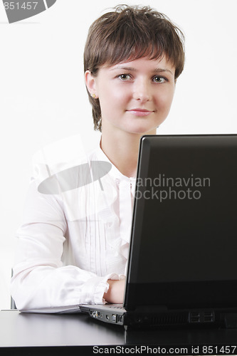 Image of Cute businesswoman with laptop