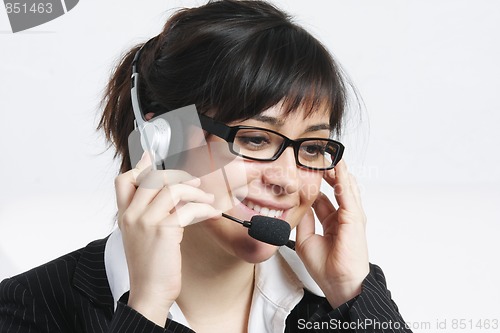 Image of Positive brunette businesswoman with headset