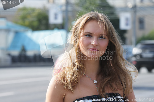 Image of Young woman in city