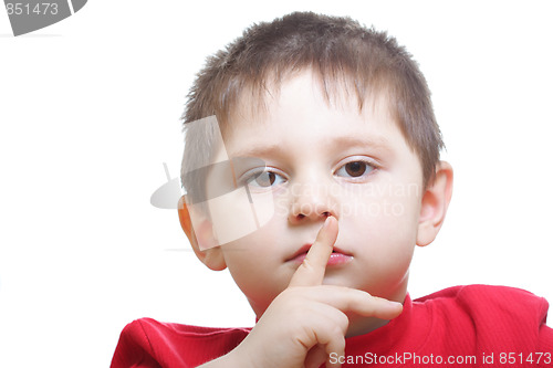Image of Boy in red showing hush gesture