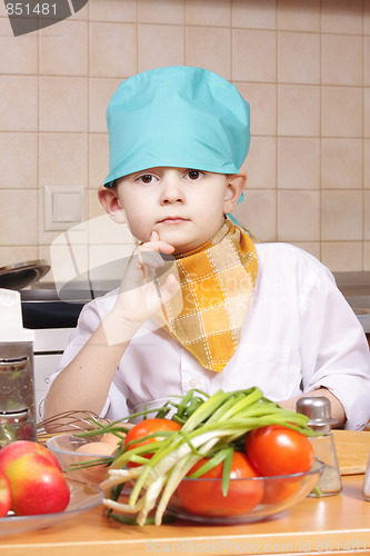 Image of Thoughtful little cook