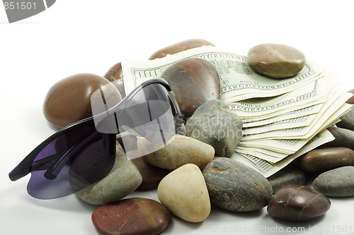 Image of Money pebbles and sunglasses