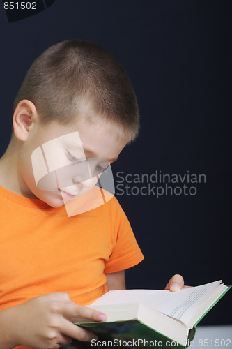 Image of Kid reading book