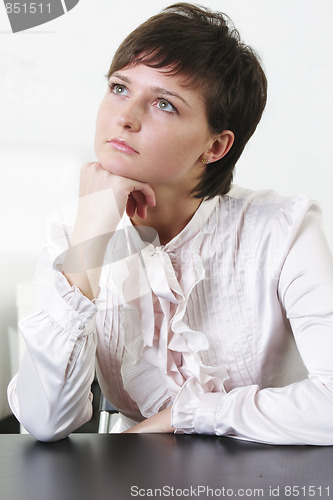 Image of Serene young woman looking up