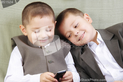 Image of Brothers with cellphone