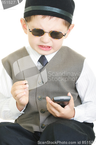 Image of Vexed kid with palm computer and stylus