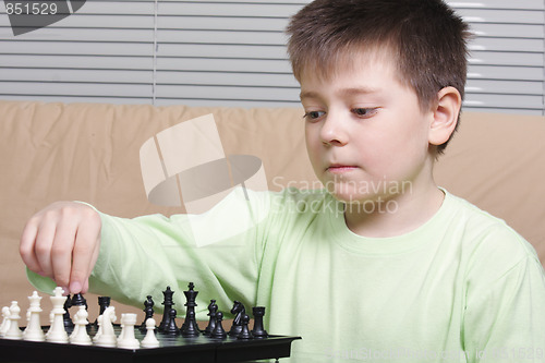 Image of Boy playing chess