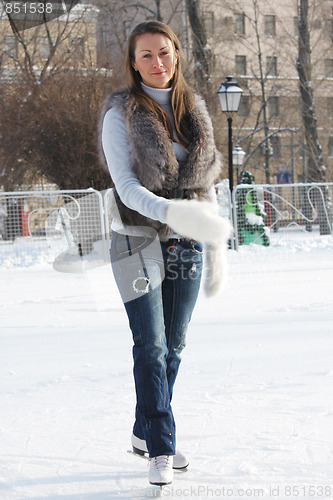 Image of Serene ice-skating young woman