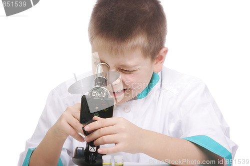 Image of Kid looking into microscope