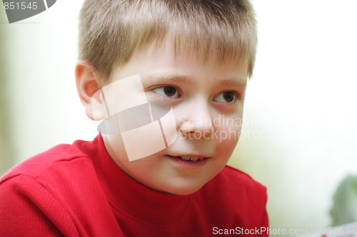 Image of Boy in red looking forward