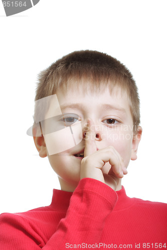 Image of Kid in red gesturing hush sign