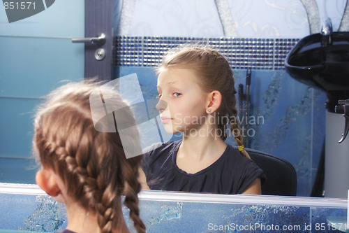 Image of Girl looking at own reflection