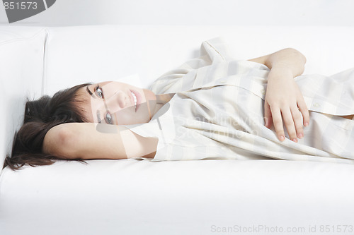 Image of Serene brunette relaxed on sofa