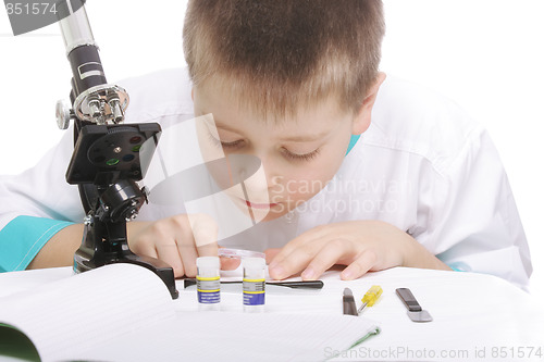 Image of Researcher bending over desk
