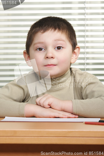 Image of Cute boy at desk